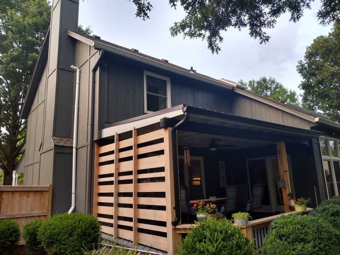 Charcoal exterior repaint with cedar screen and covered porch